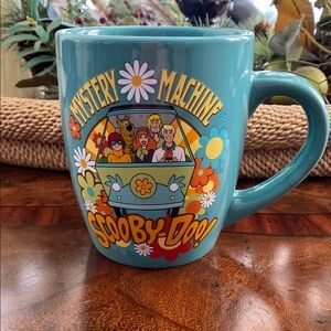 Teal Cartoon Mug with Floral Design